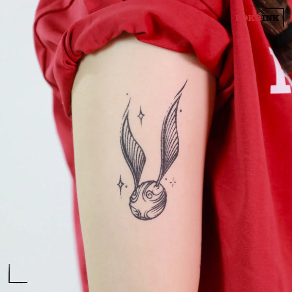 Flying Magical Ball With Wings Tattoo